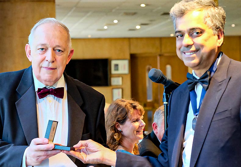 Dr John Annear receiving Lifetime Achievement Award 2019 from Mr Abdul Sultan