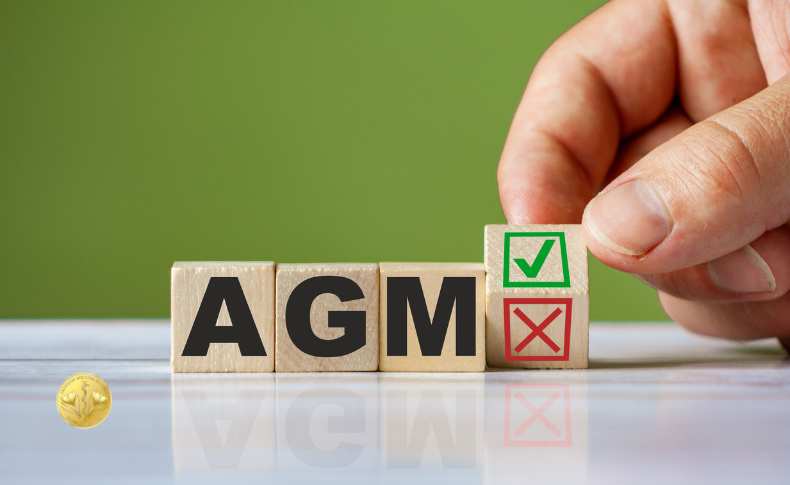 AGM blocks with hand placing a green tick block